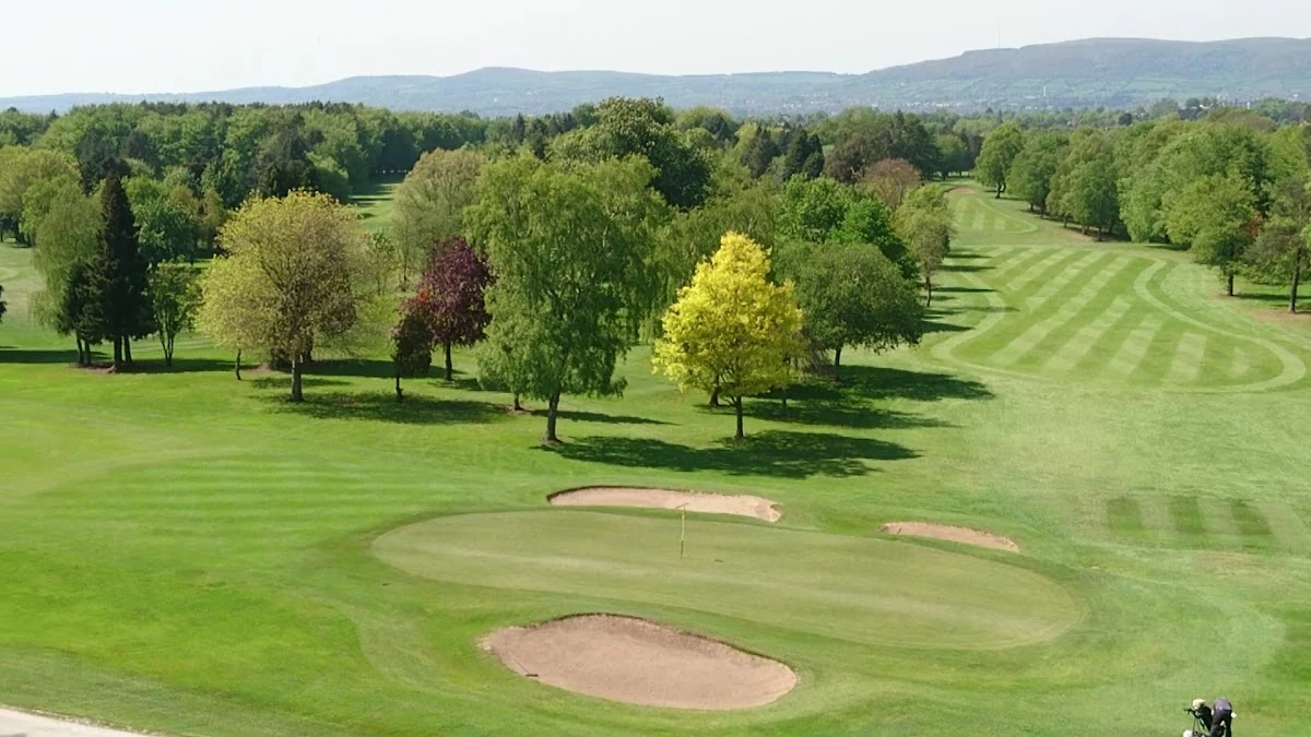 Belvoir Park Golf Club — a green ringed by bunkers on the Harry Colt parkland course