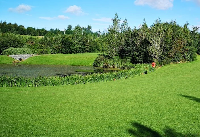 Castlereagh Hills Golf Club — a water hazard and stone bridge beside a green Castlereagh Hills Golf Club — a water hazard and stone bridge beside a green