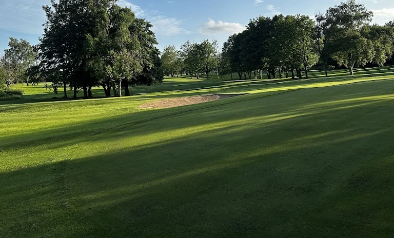 Cliftonville Golf Club — a bunkered parkland hole beneath the trees Cliftonville Golf Club — a bunkered parkland hole beneath the trees