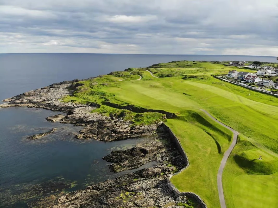 Portstewart Golf Club — a coastal hole on the Strand Course running along the rocky shoreline